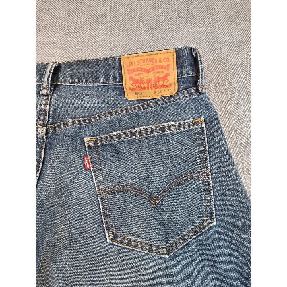 Levis 559 Relaxed Straight Jeans Mens 33x34 Medium Wash Blue Distressed Thrashed
